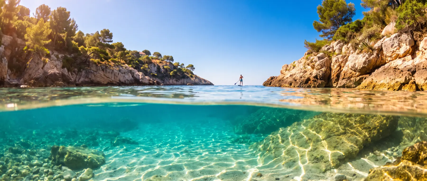 A seabob under clear water beside the bathing platform.